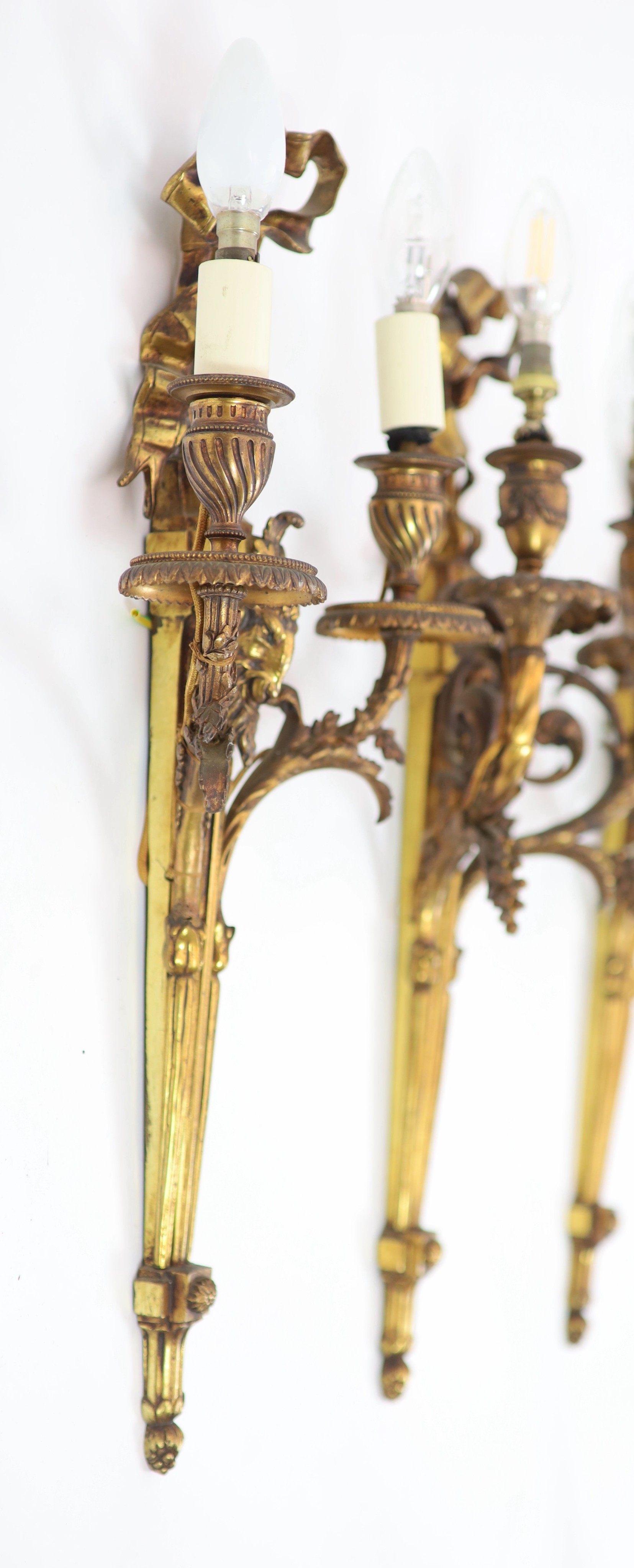 Two pairs of Adam Revival ram's mask head motif wall lights H 59cm. W 29cm. & H 59cm. W 23cm.